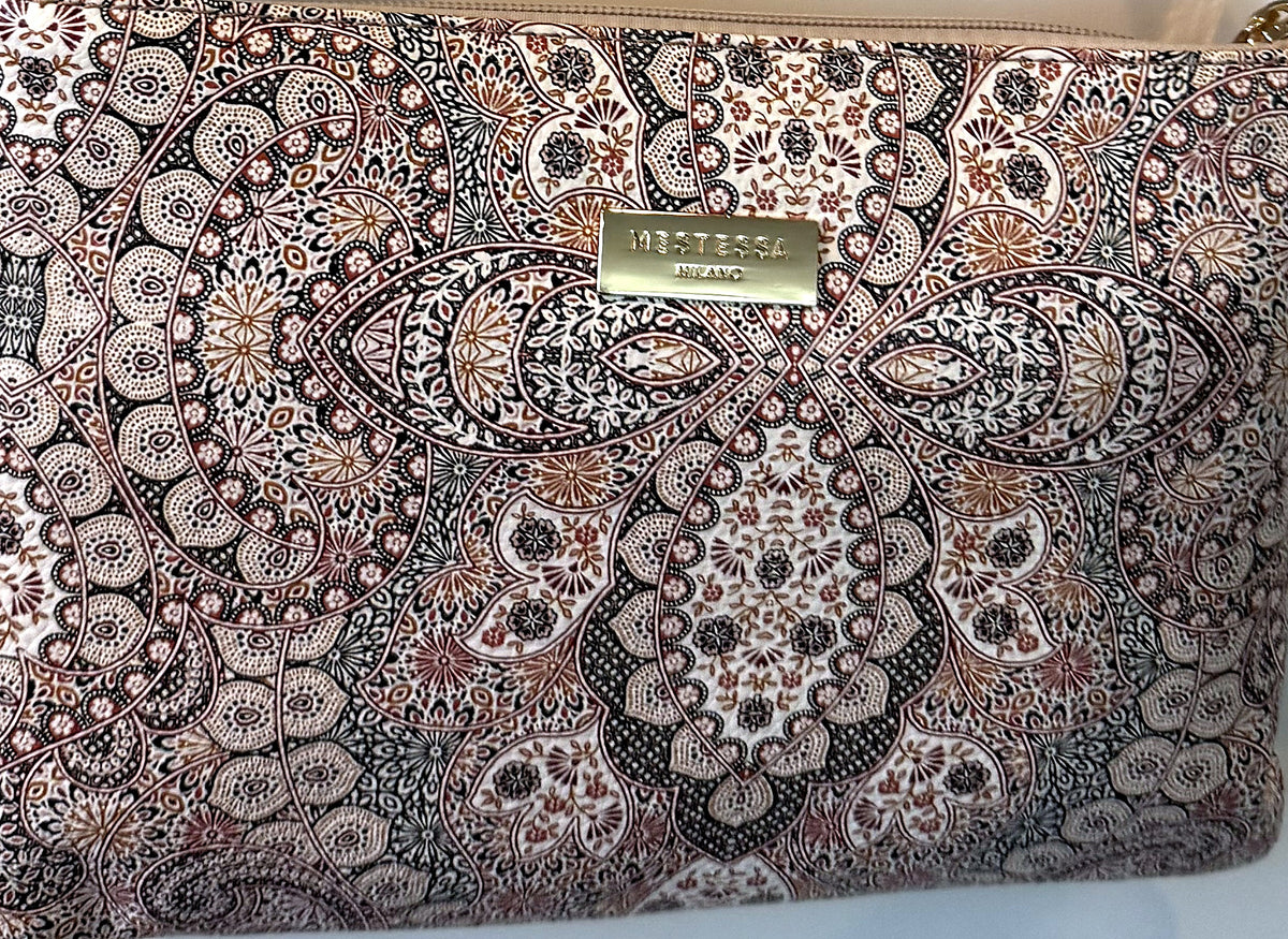 Close-up of the paisley print and Mestessa Milano gold logo plate