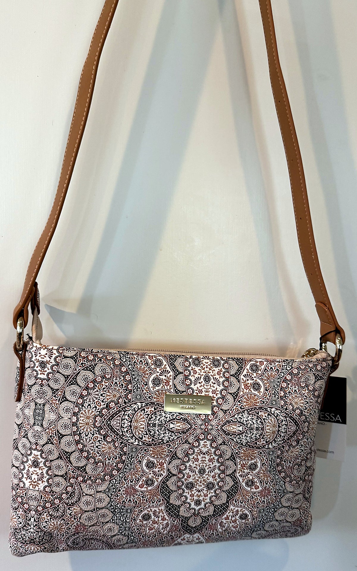 Sofia pochette shown full length with adjustable crossbody strap